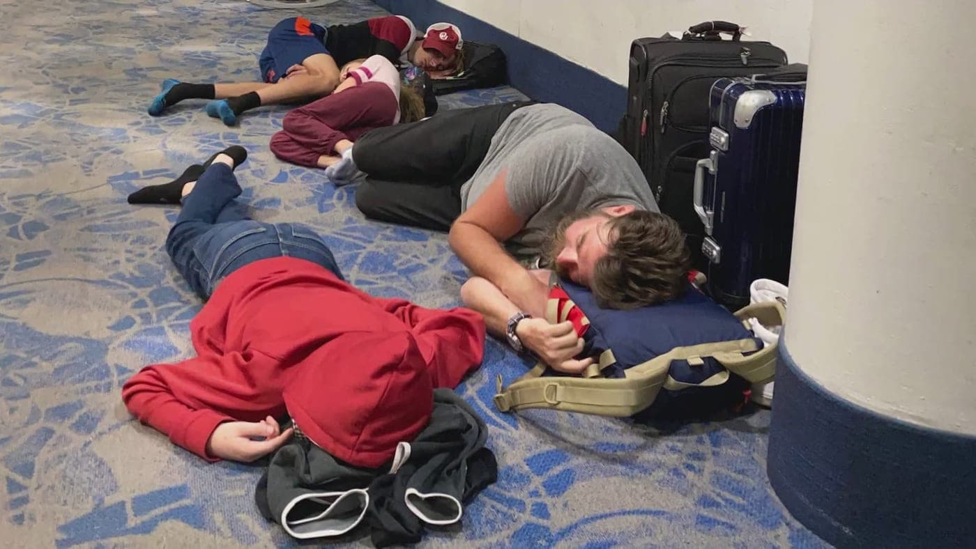 A crowded airport terminal during a long wait